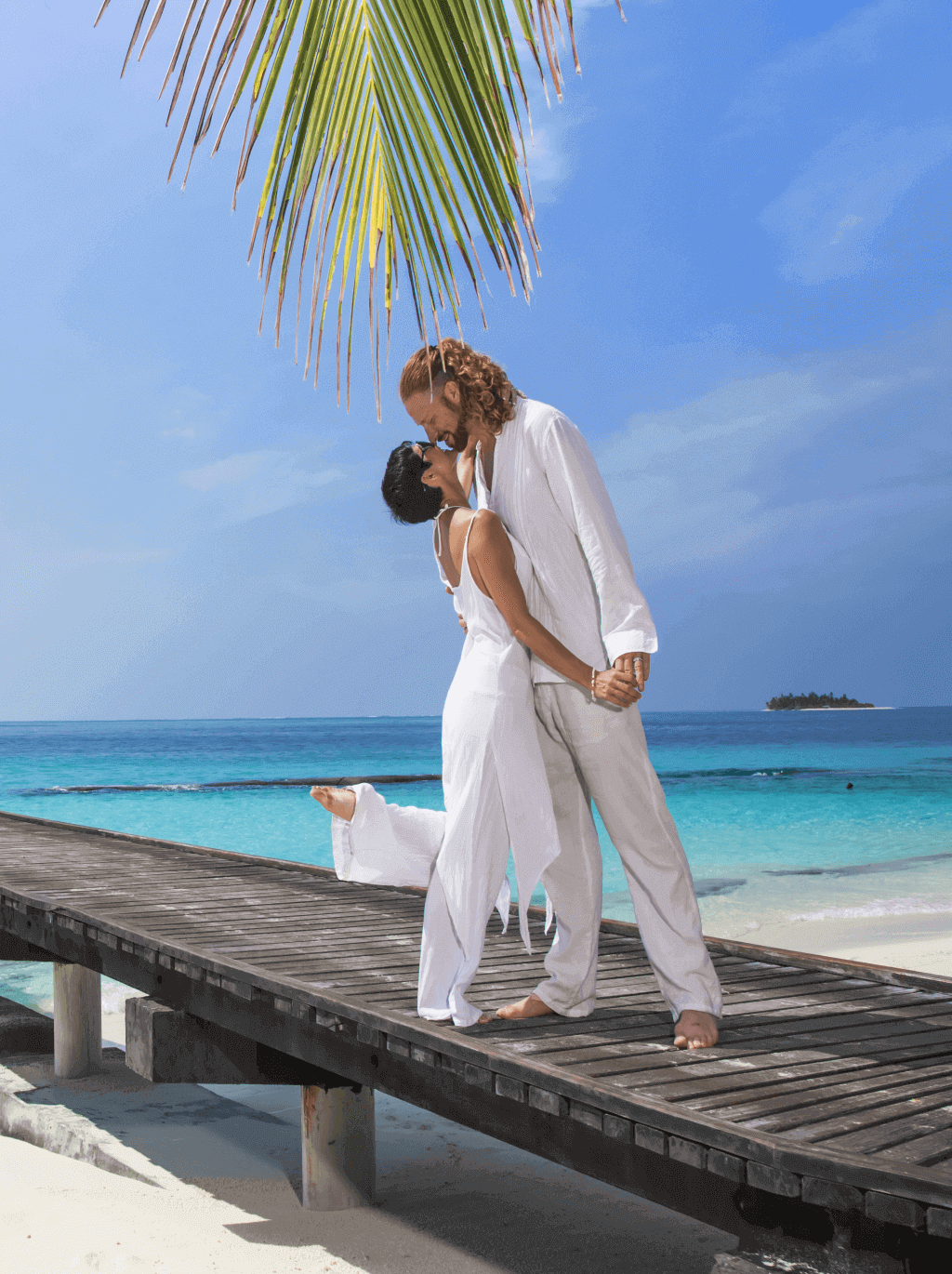 Young couple enjoy at Maldives Beach 
