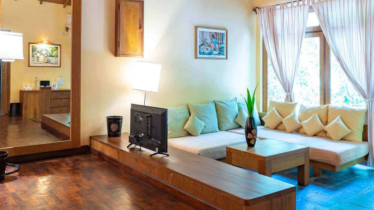 Closeup of a sofa in a lounge at Reethi Garden Villa, Maldives