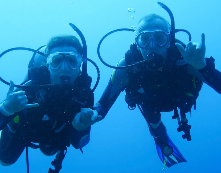 Enjoying scuba training submerged in ocean at Maldives