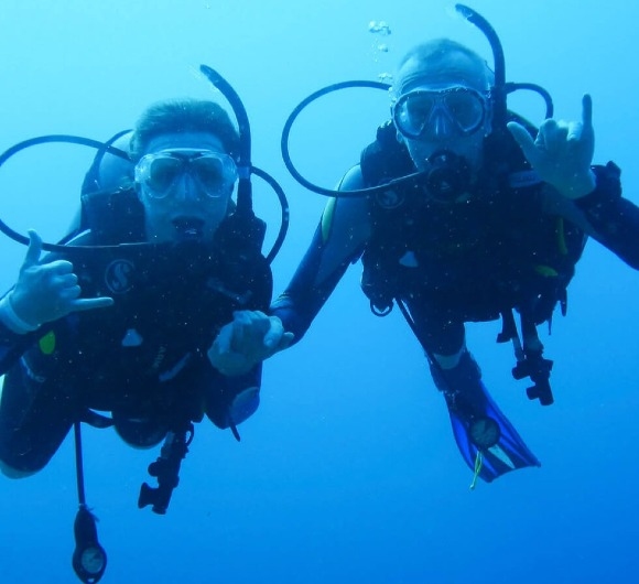 Enjoying scuba training submerged in ocean at Maldives