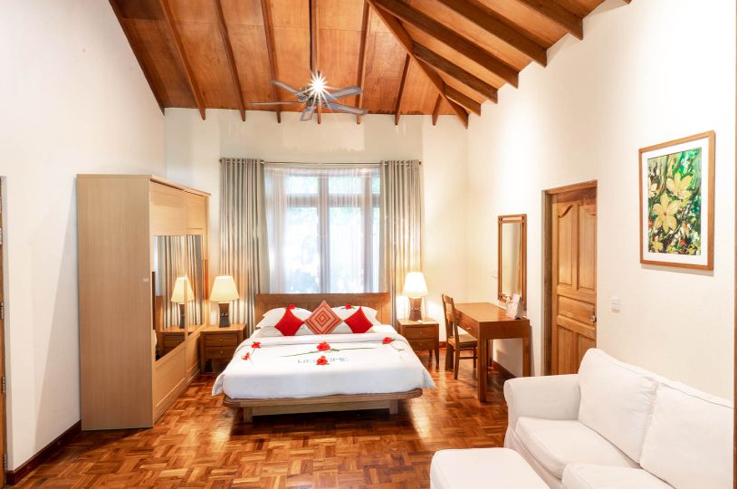 Interior of luxury king bed with furniture in reethi suite, Maldives