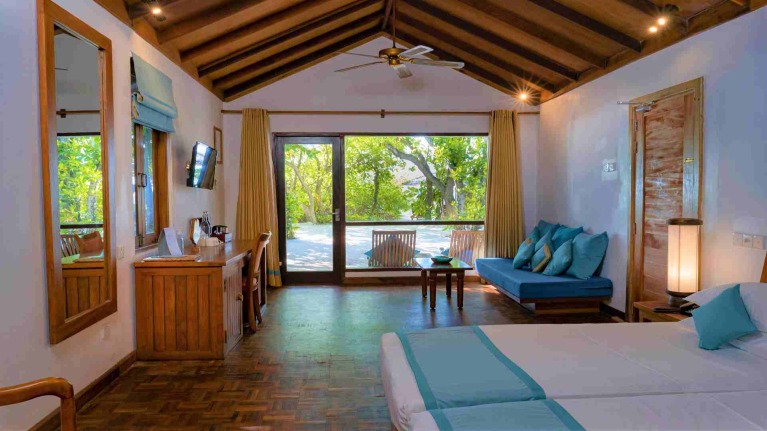 Interior of classic beach villa with beach view at Maldives