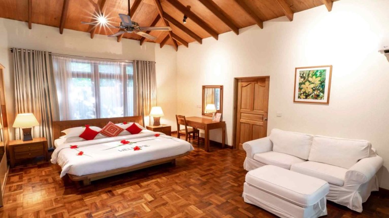 Luxury villa with sofa set at Reethi Beach Resort