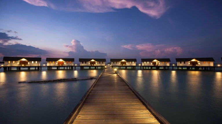 Over water villa with ocean and sun set view